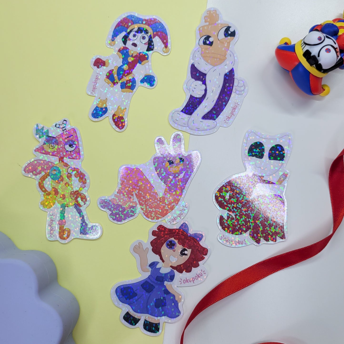 The Amazing Digital Circus sticker pack featuring the main six characters shown in use