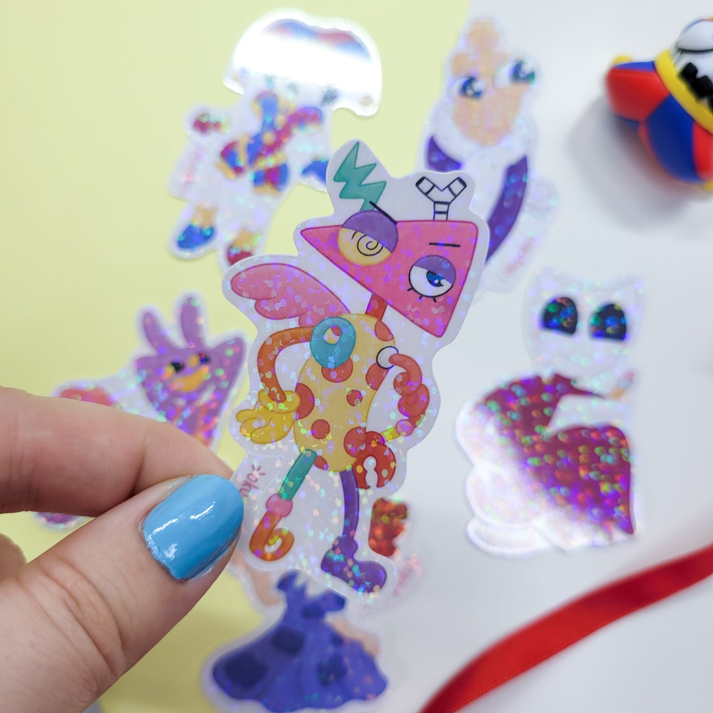 The Amazing Digital Circus sticker pack featuring the main six characters shown in use