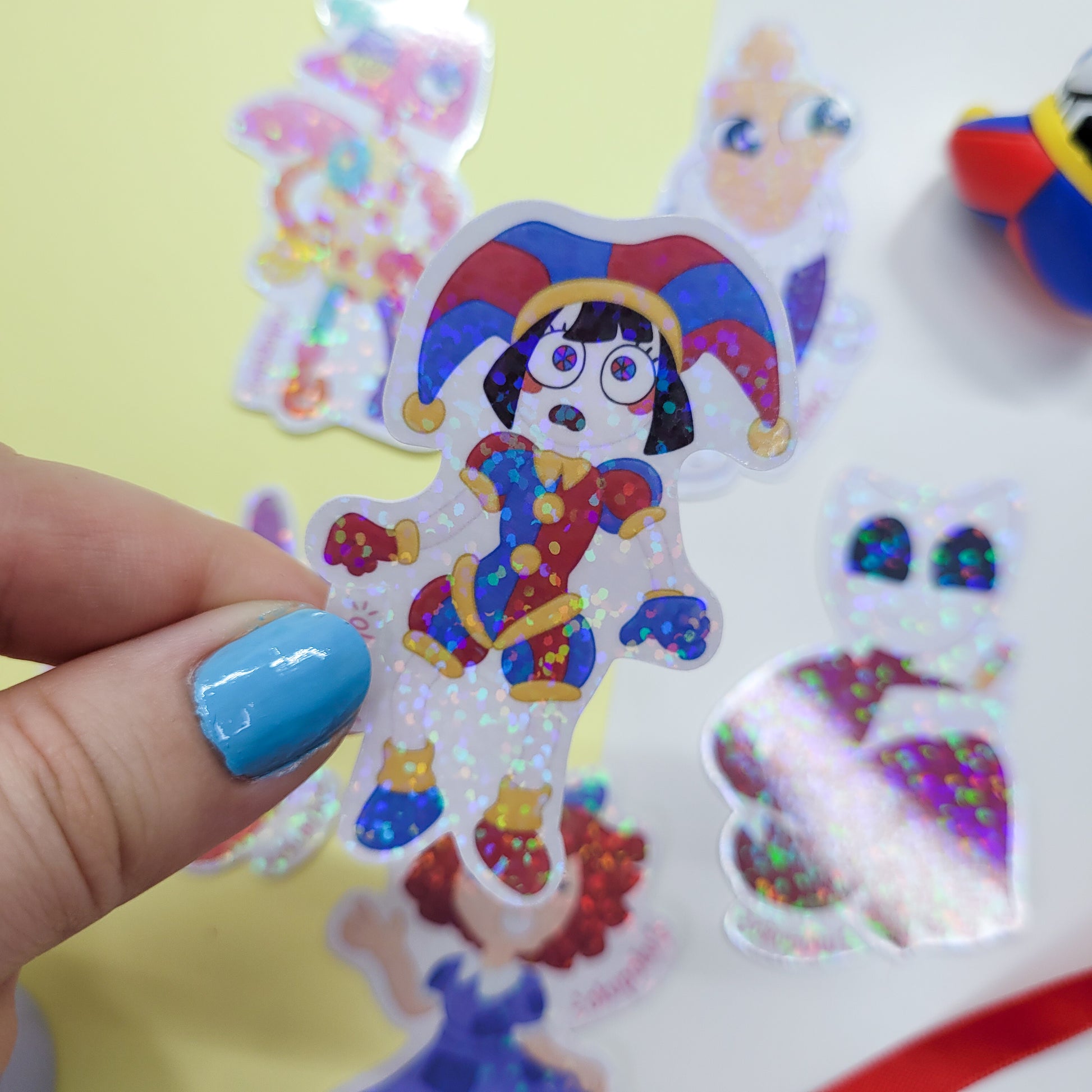 The Amazing Digital Circus sticker pack featuring the main six characters shown in use