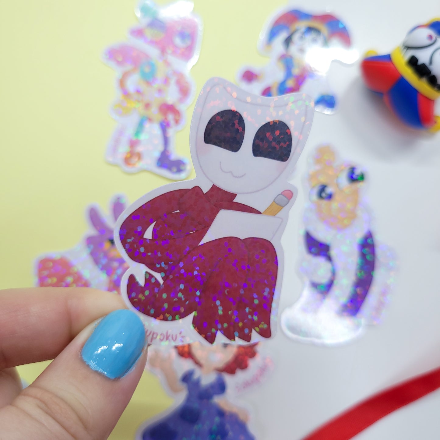 The Amazing Digital Circus sticker pack featuring the main six characters shown in use