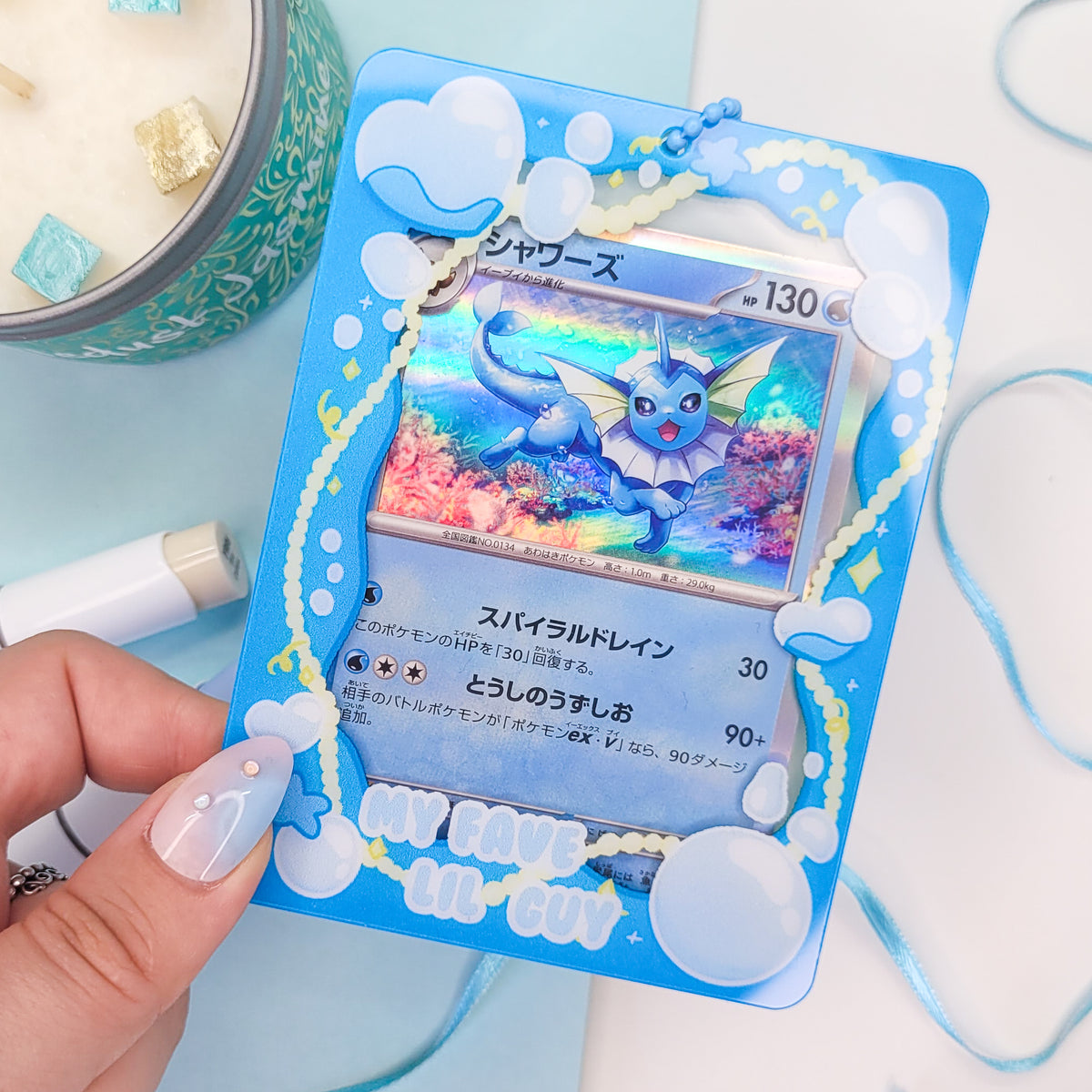 Water themed photocard holder made out of acryllic with blue chain