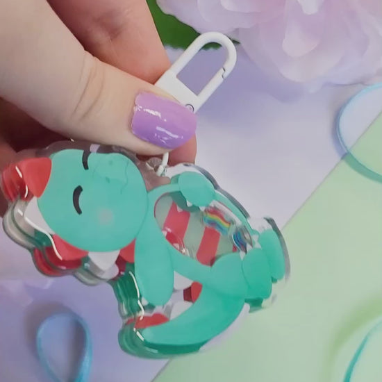 Peppermint T-Rex shaker keychain with a belly full of sweets