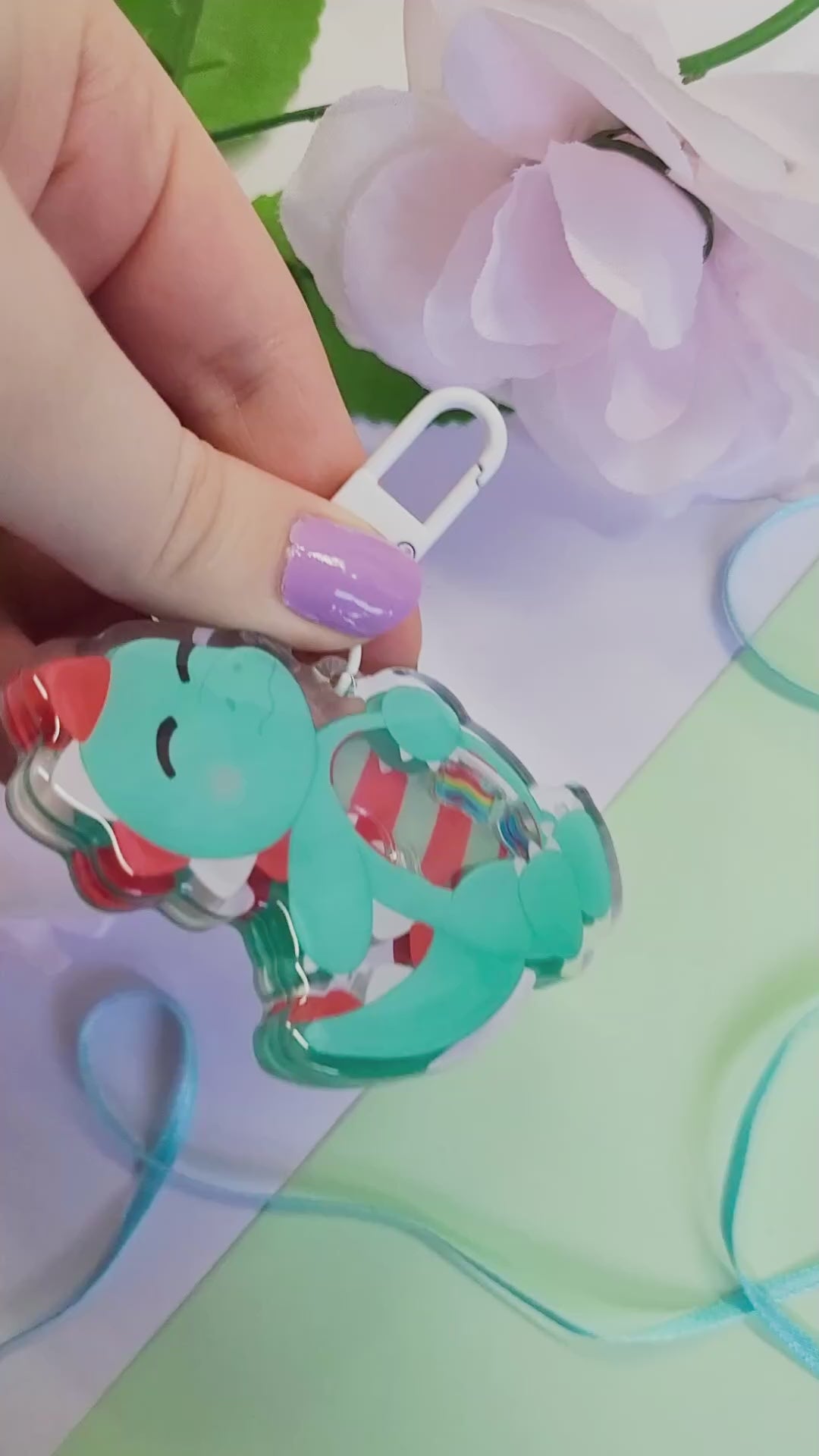 Peppermint T-Rex shaker keychain with a belly full of sweets