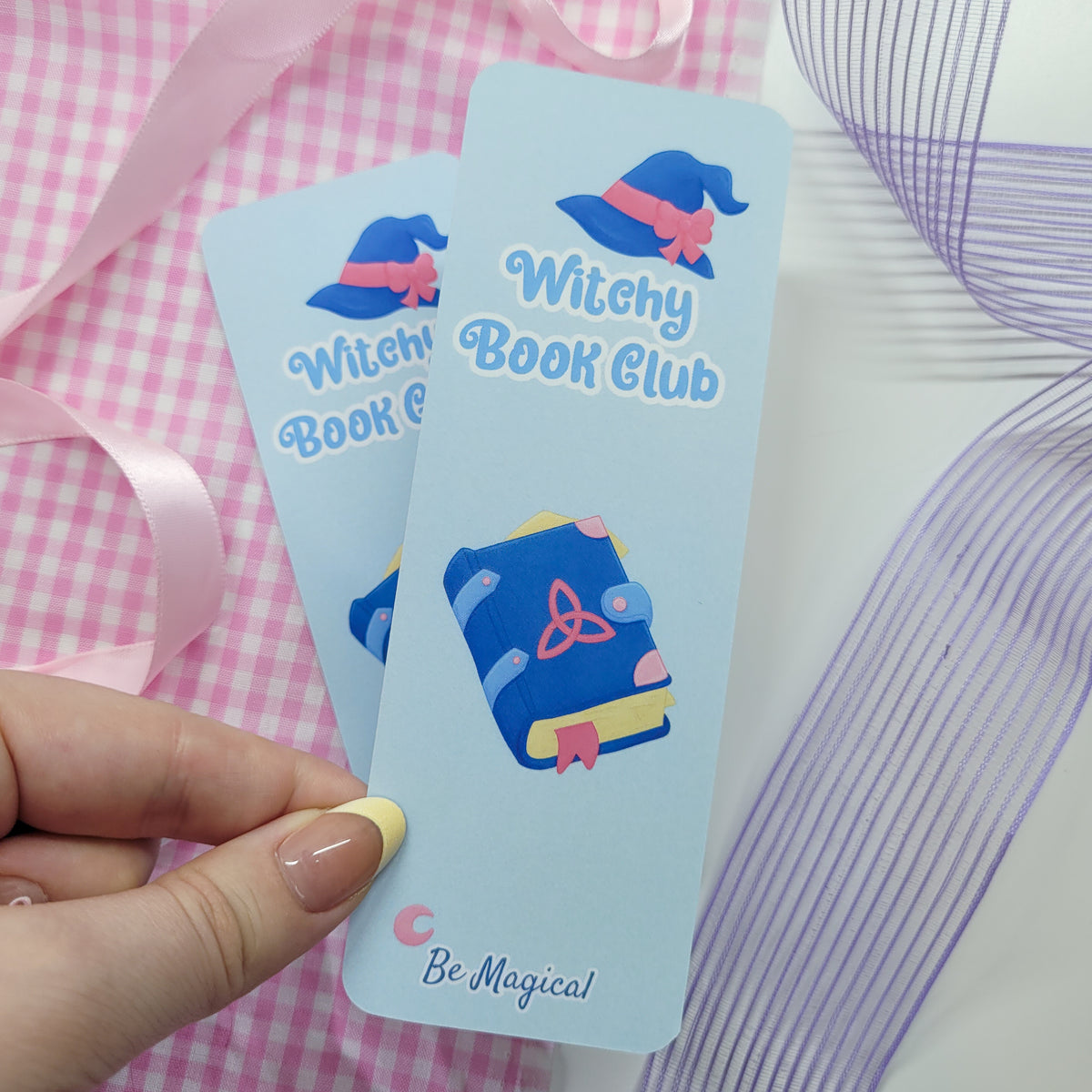 Witchy book club bookmark shown in use