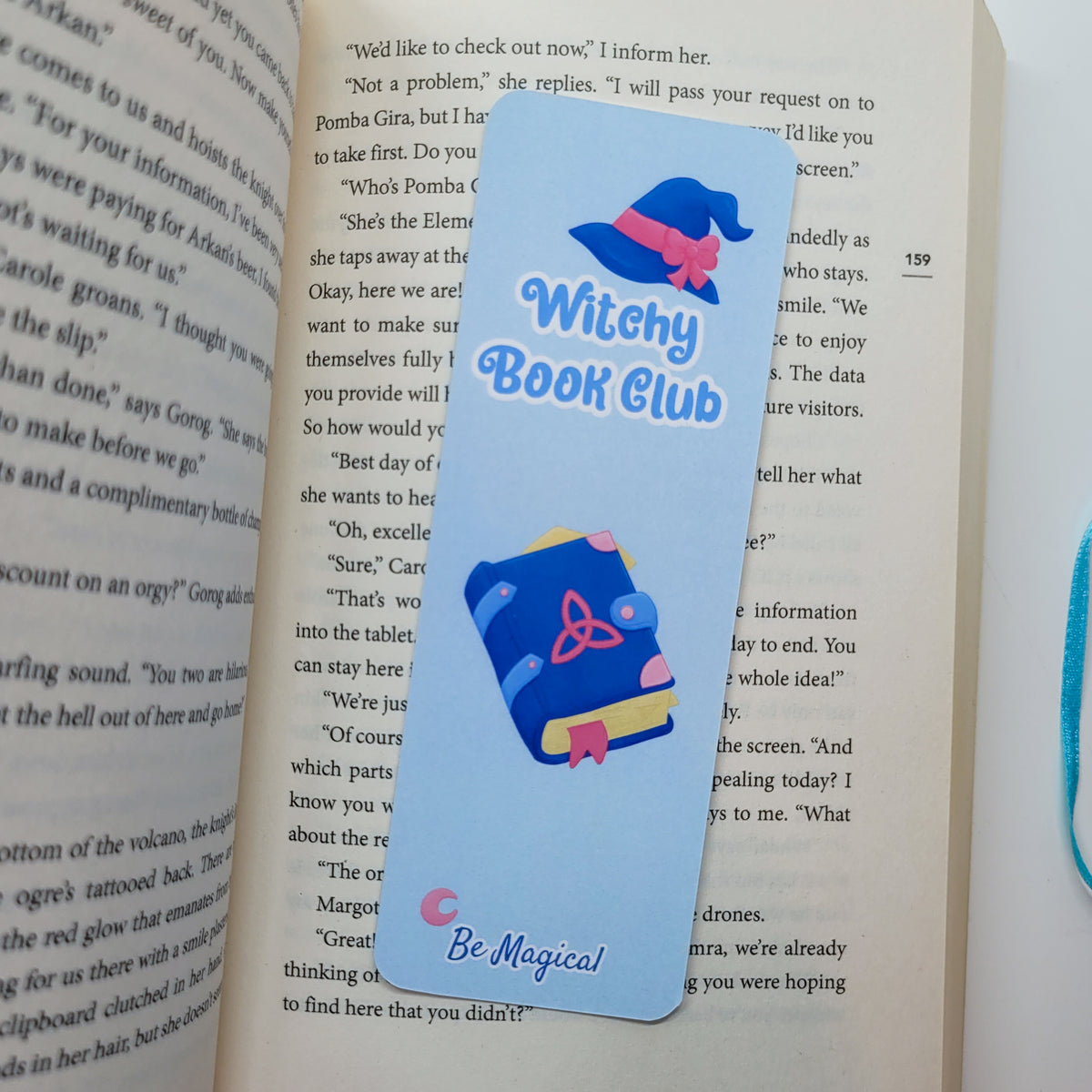 Witchy book club bookmark shown in use